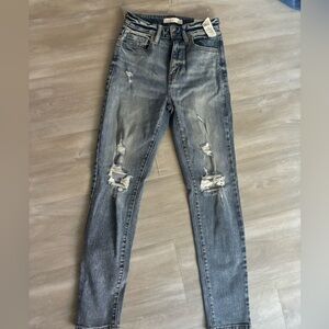 light blue ripped jeans